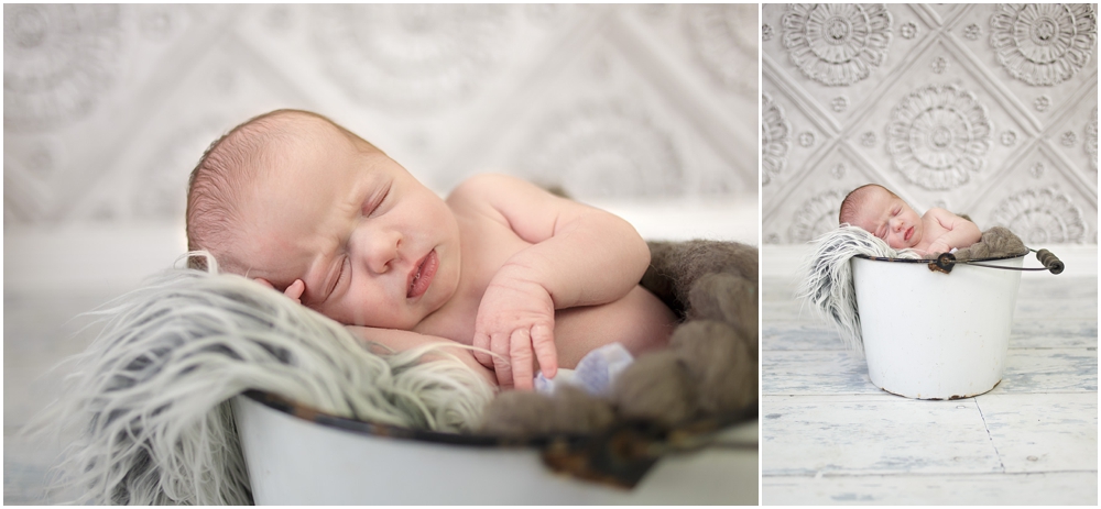 Aurora newborn in white bucket
