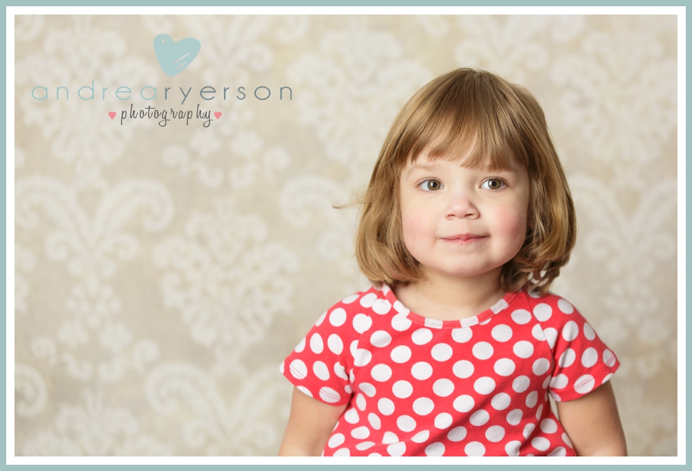 child in red and white polka dot shirt