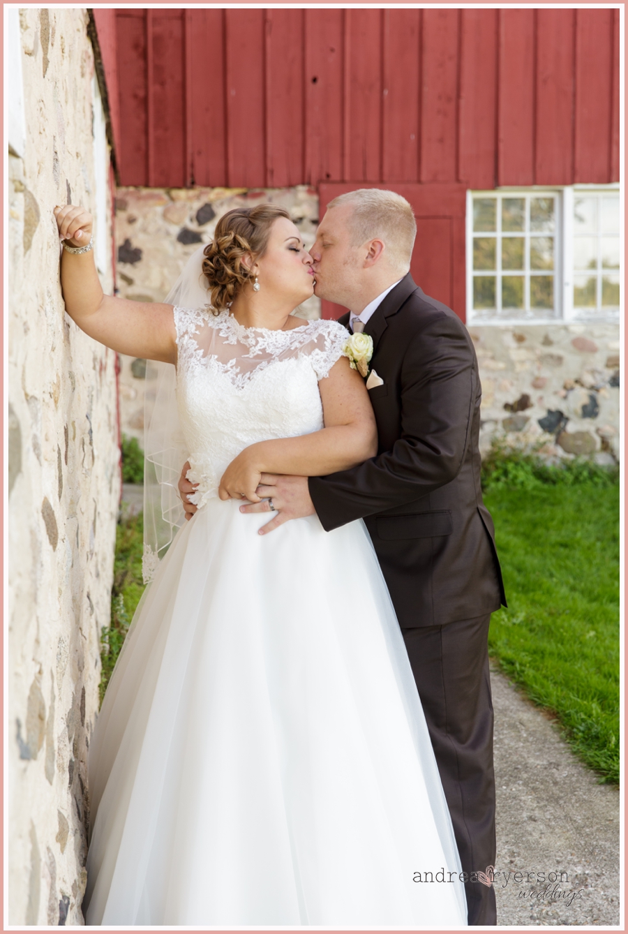 bride and groom in front of barn in Delafield Wisconsin