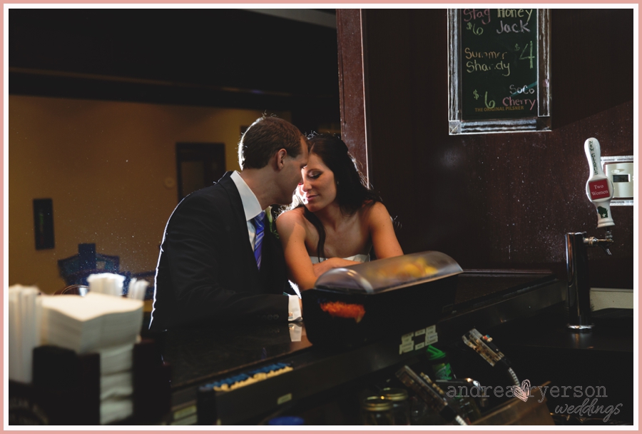 bride and groom at the bar