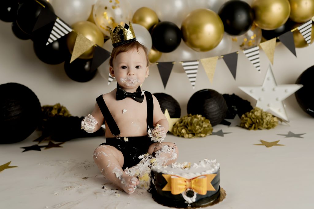one year old boy black and gold cake smash